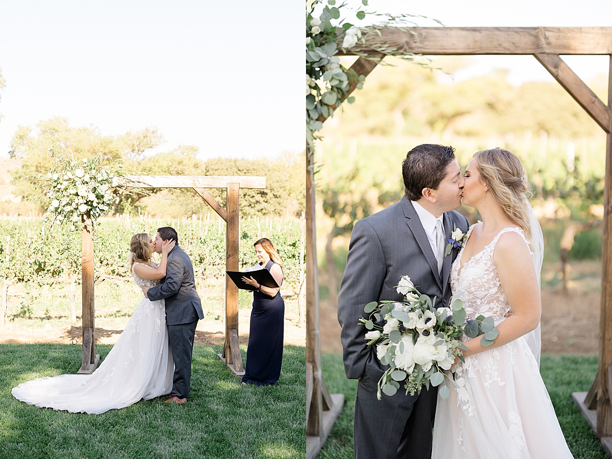 bride in romantic gown and groom in gray suit share a kiss during wedding shot by Hunter Hennes Photography