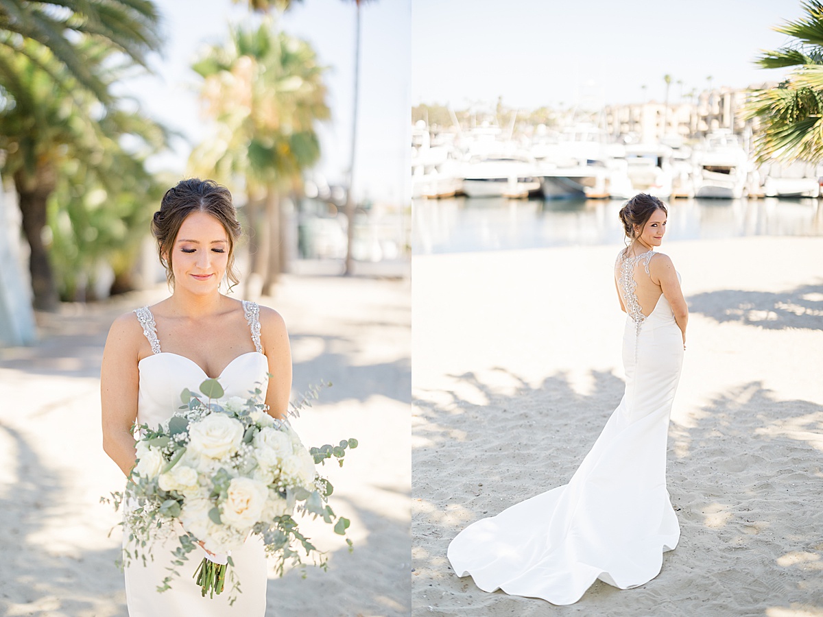 bride in elegant gown with beaded straps poses with white rose bouquet during shoot with Hunter Hennes Photography