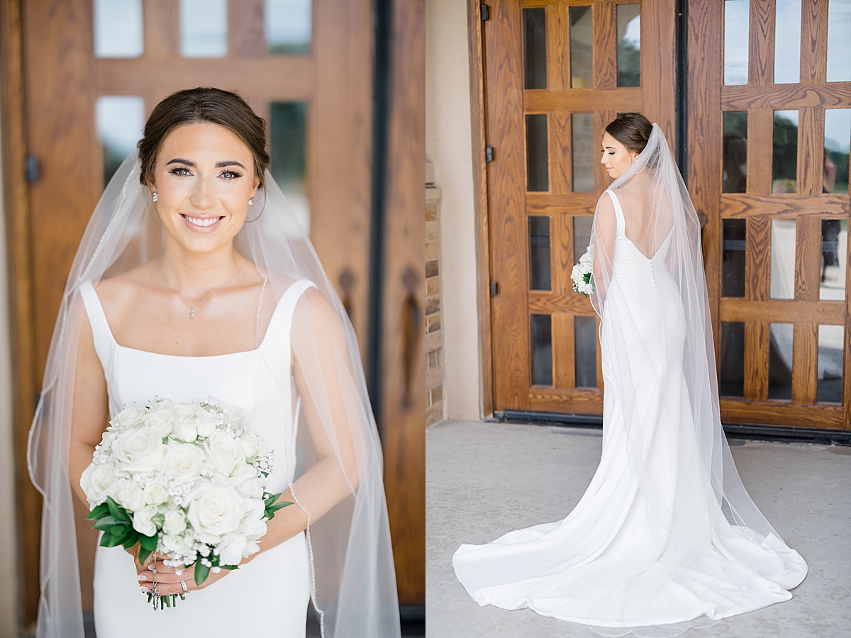bride in elegant minimalist gown with white flowers poses before heartfelt Catholic ceremony