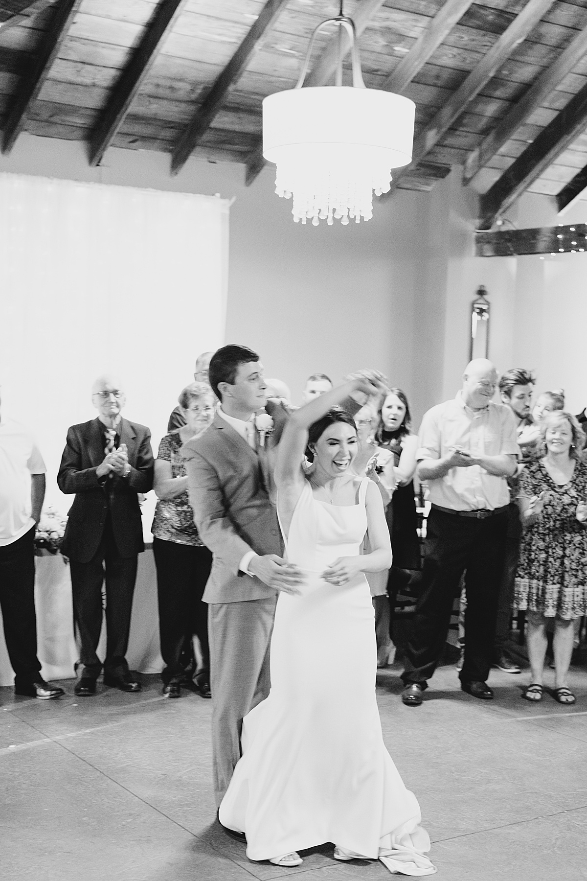 bride and groom share celebratory first dance at reception shot by destination wedding photographer