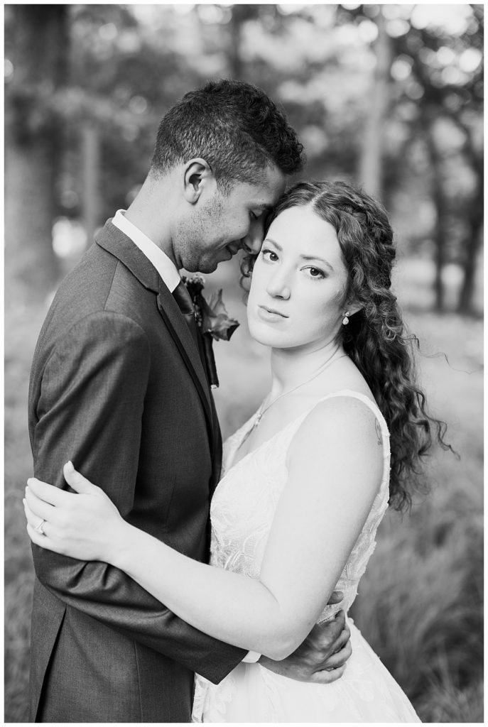 man rests his head on woman while she looks to the side by Hunter Hennes Photography 