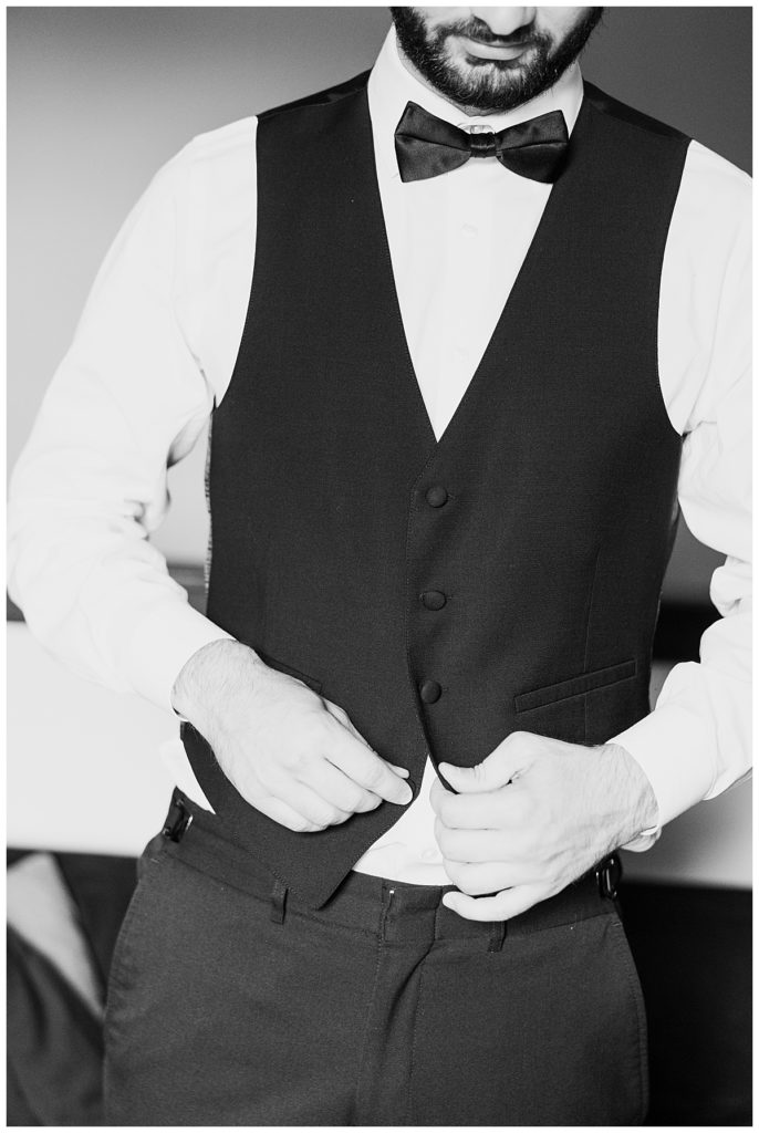 man buttons vest by destination wedding photographer