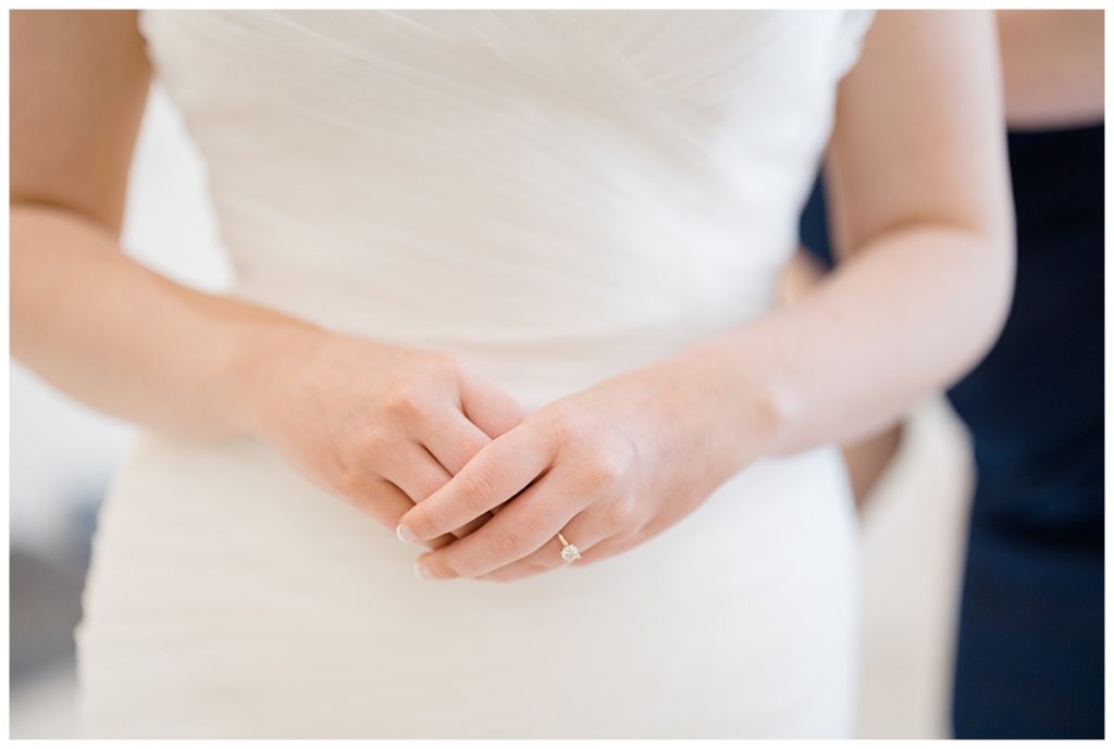bride holds her hands in front of herself by destination wedding photographer