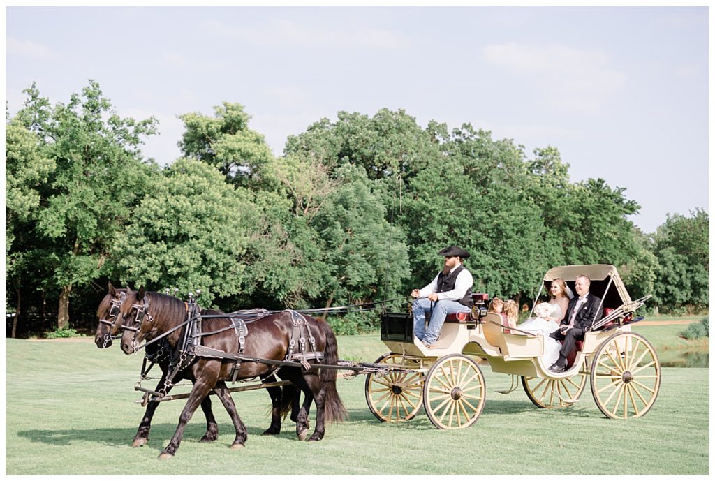 bride and father arrive by horse and carriage by Hunter Hennes