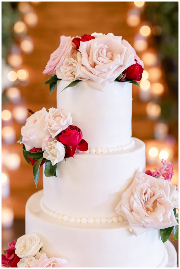 wedding cake decorated with florals by Hunter Hennes Photography