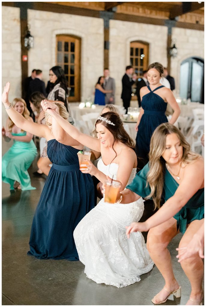 bride dances with guests by Hunter Hennes Photography