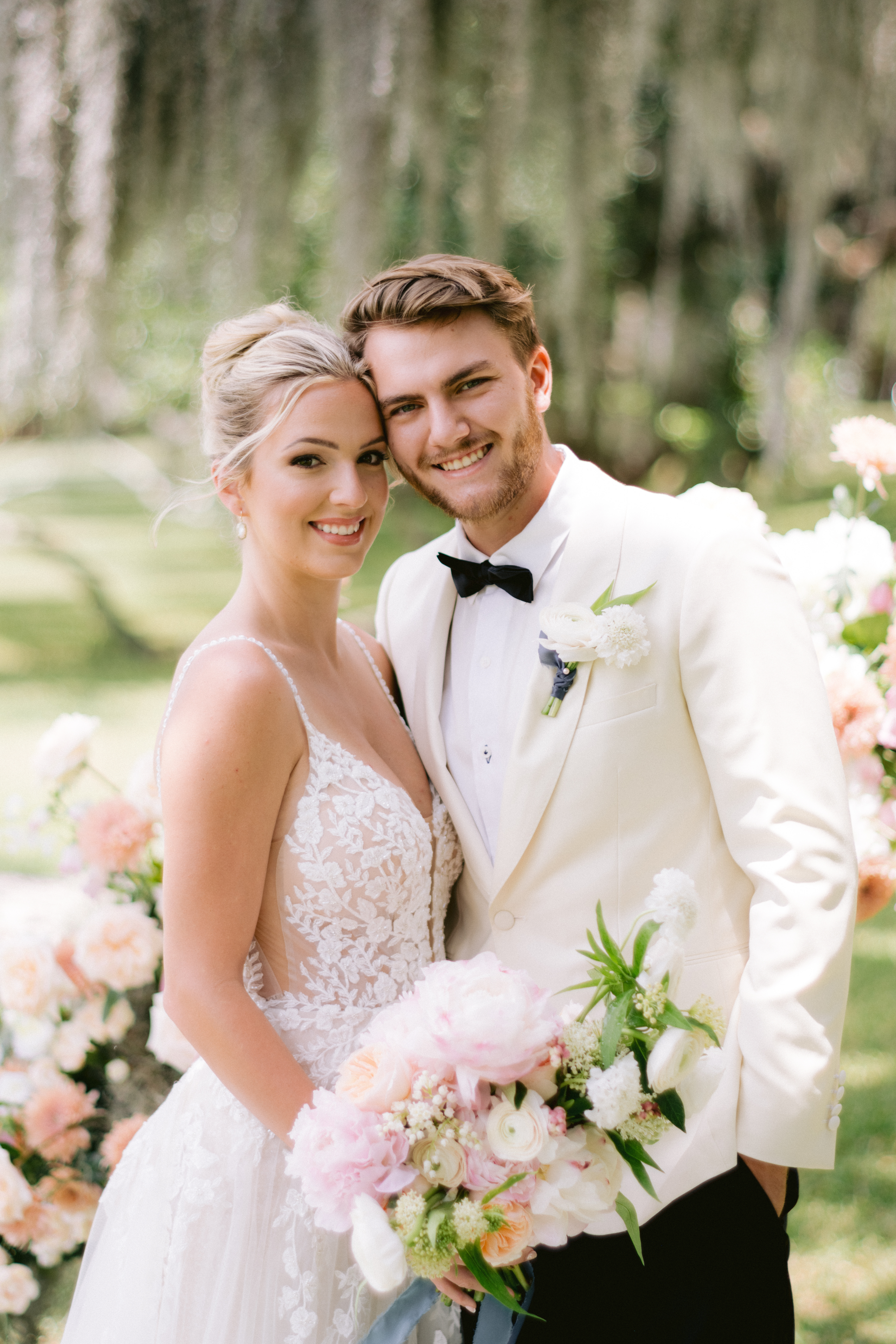 bride and groom smiling at camera