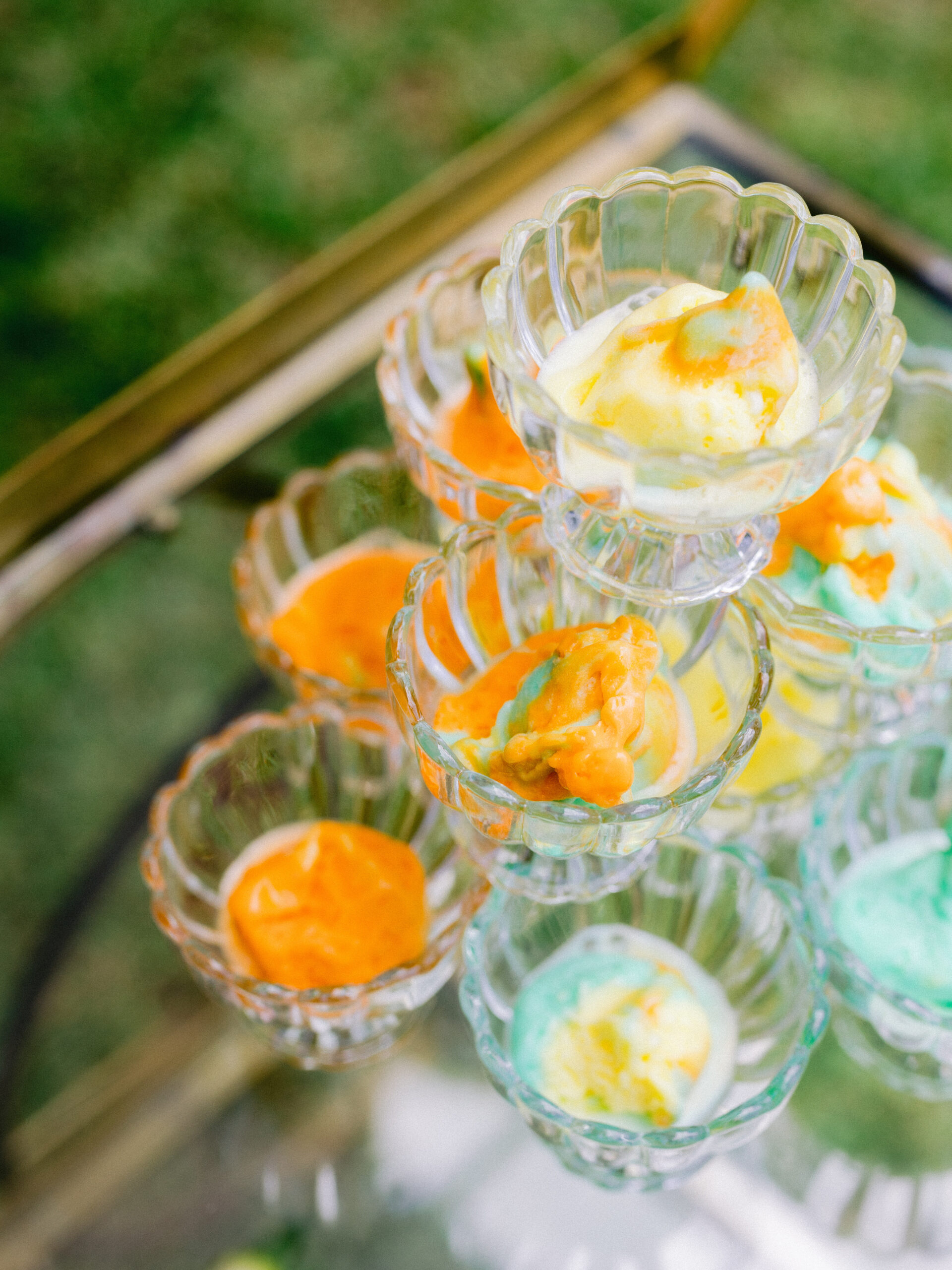 ice cream in glass jars on top of golden cart