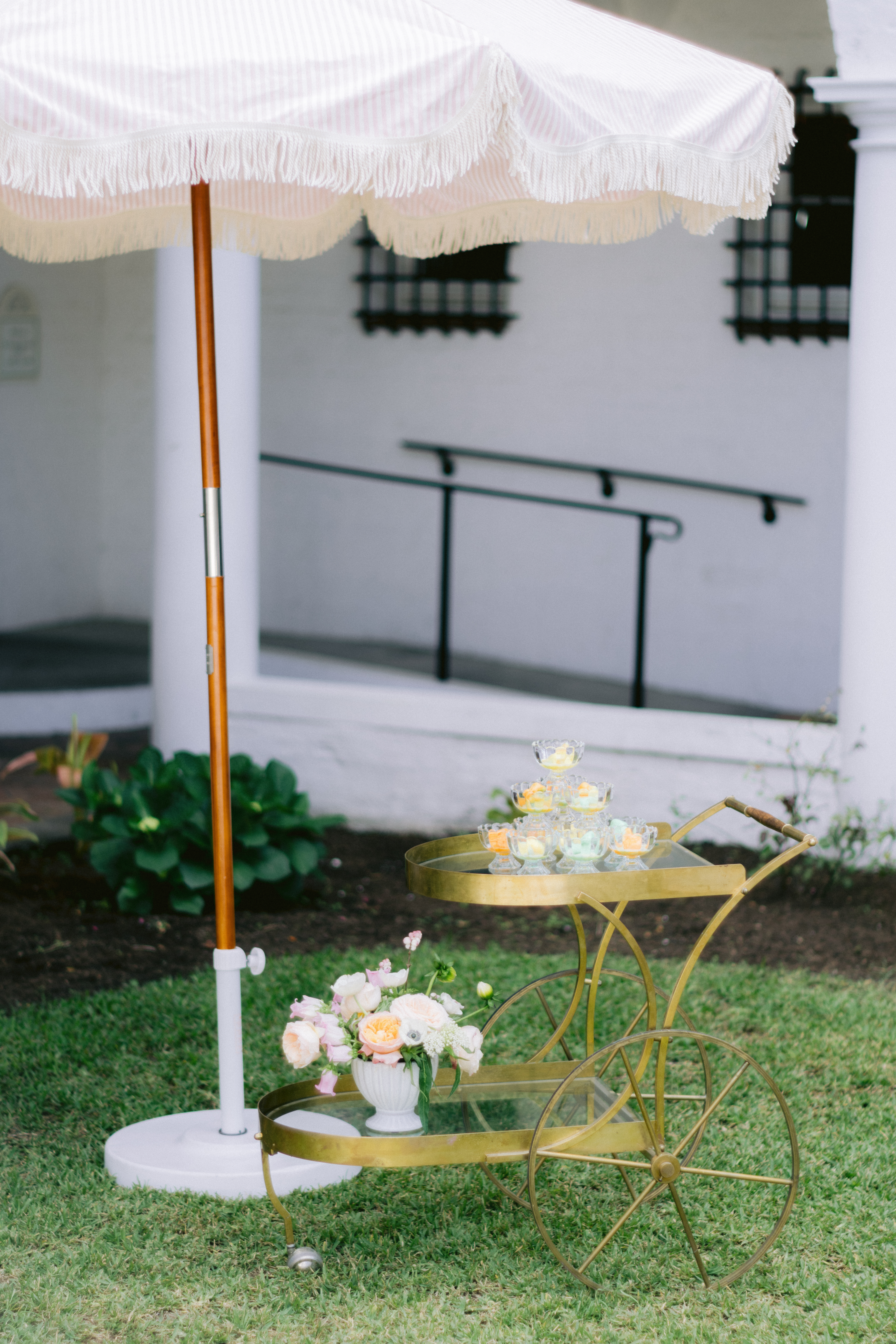 gold cart with flowers and ice cream on it 