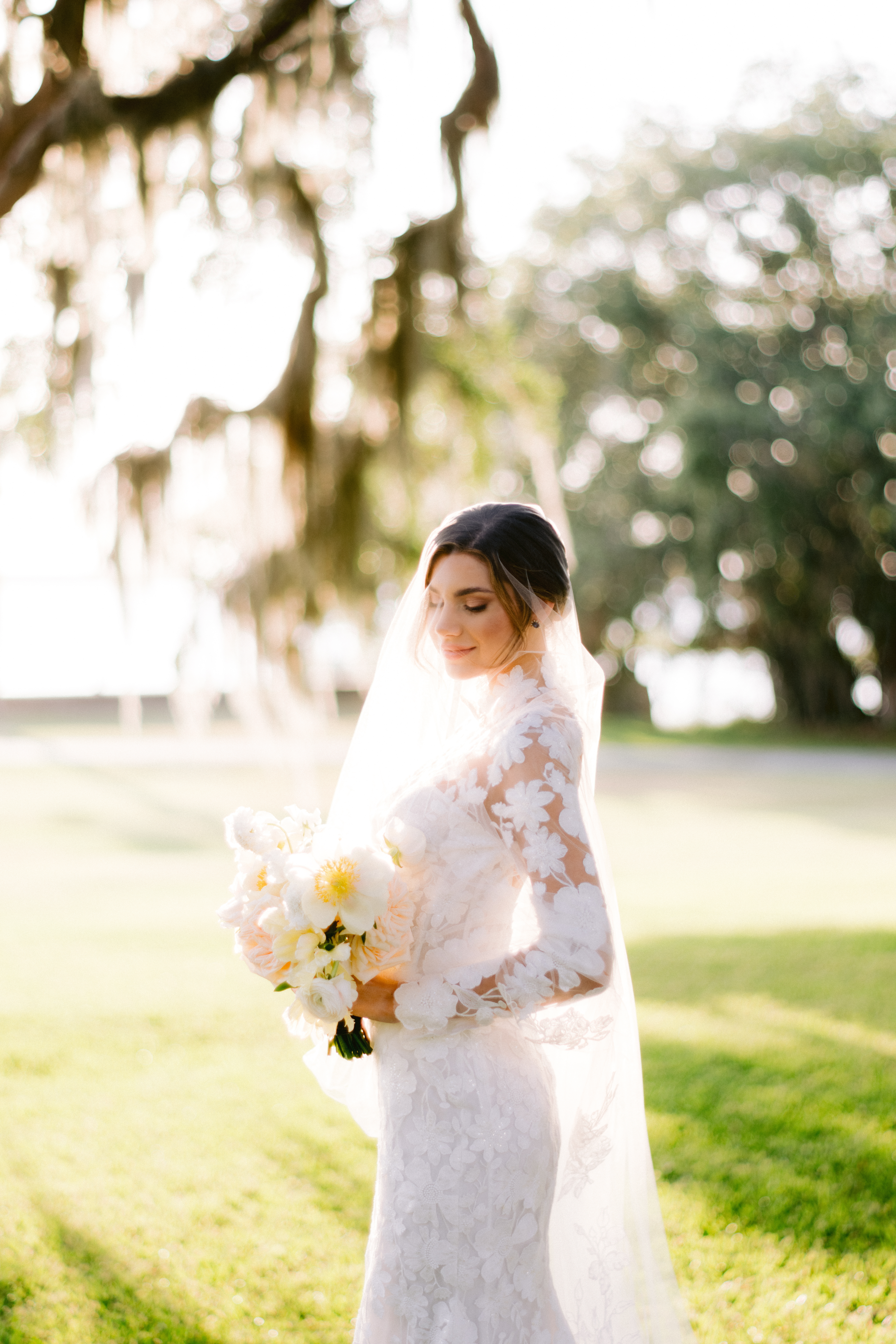 photo of bride under oak tree