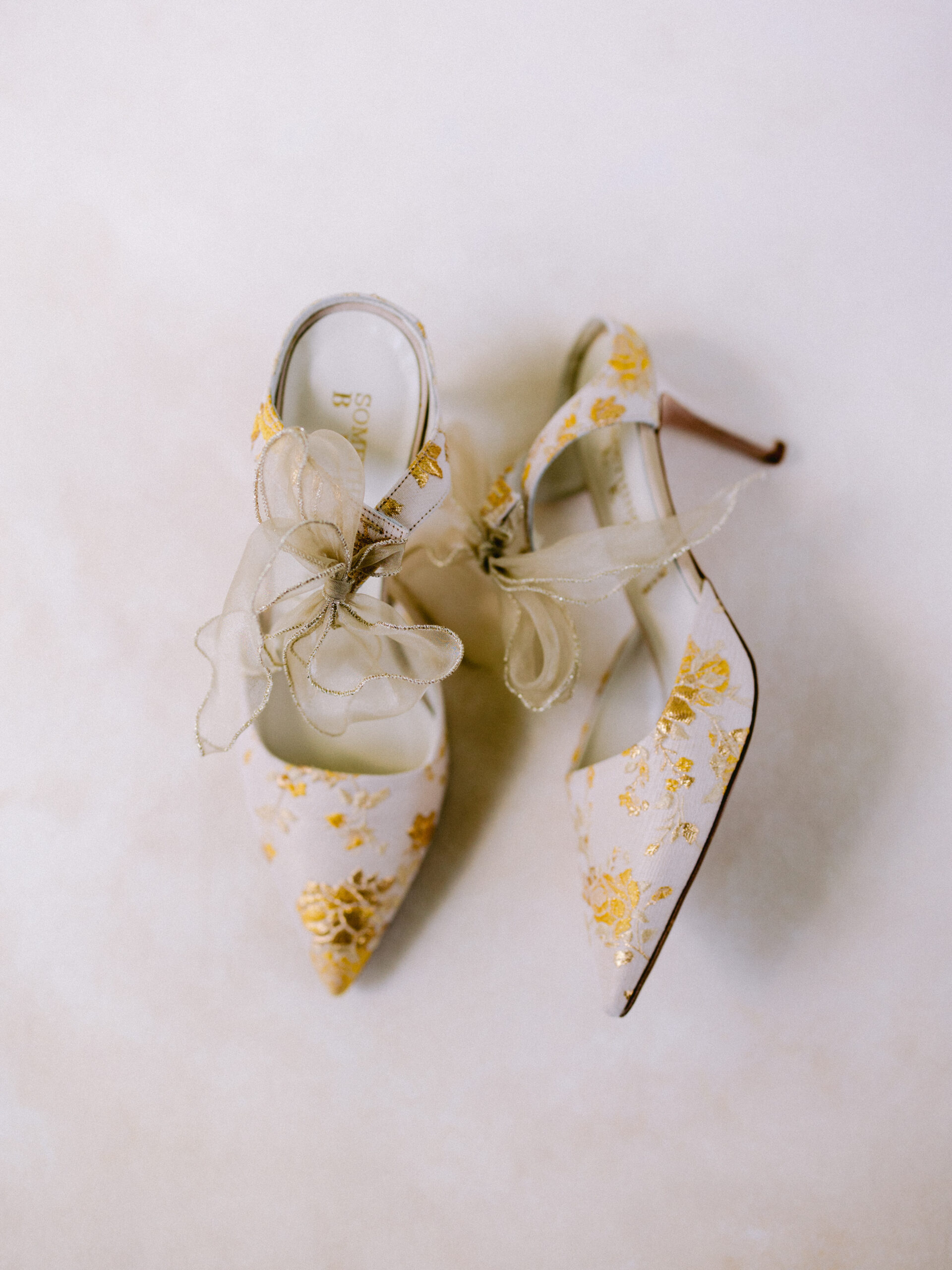 gold and white wedding shoes