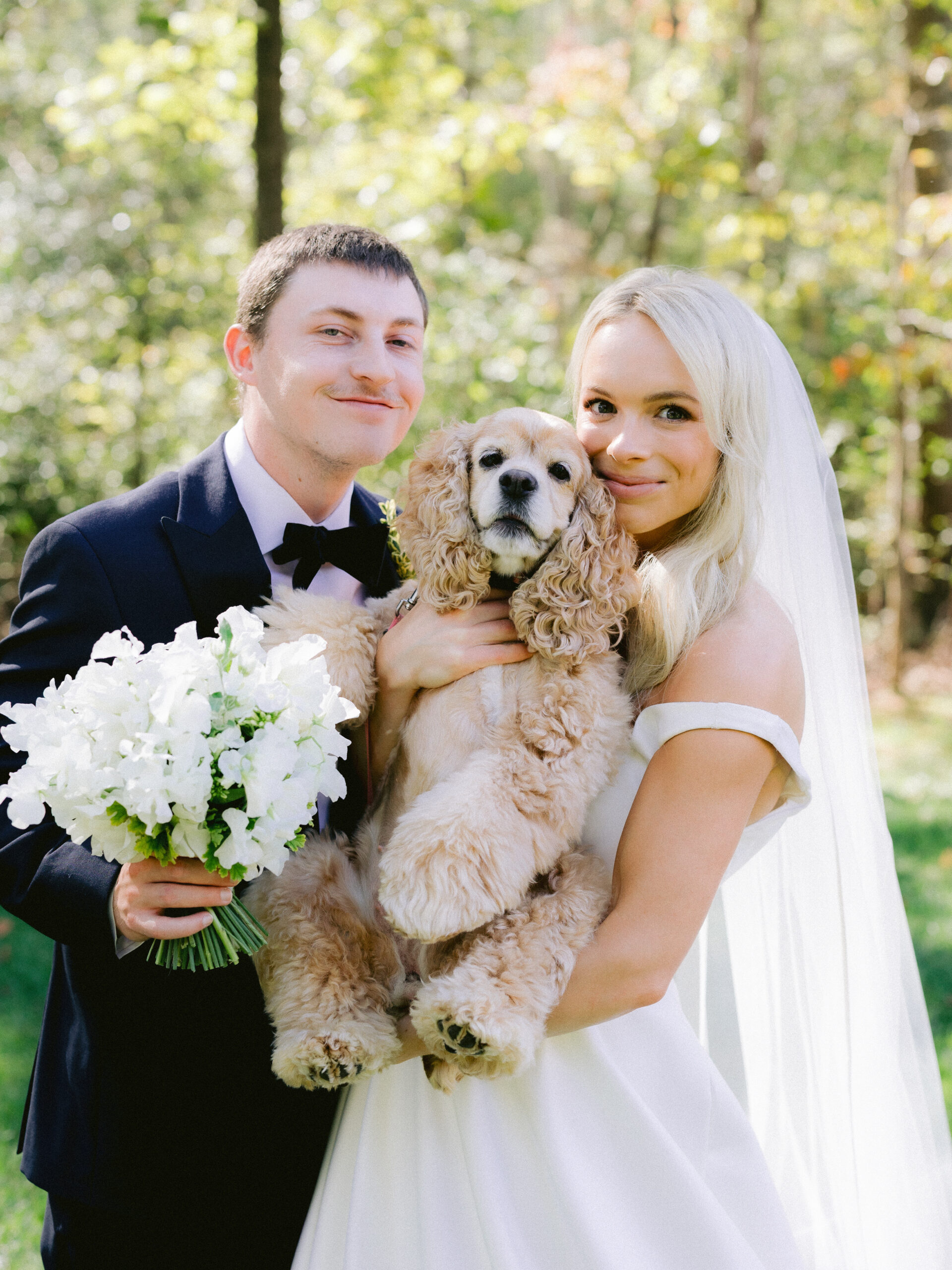 Private Estate Wedding couple with their dog facing the camera